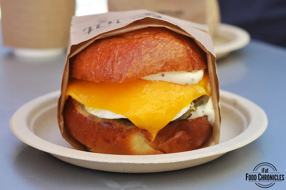 Sausage, egg and cheese with house made turkey sausage, over medium egg, cheddar cheese and honey mustard aioli in a warm brioche bun
