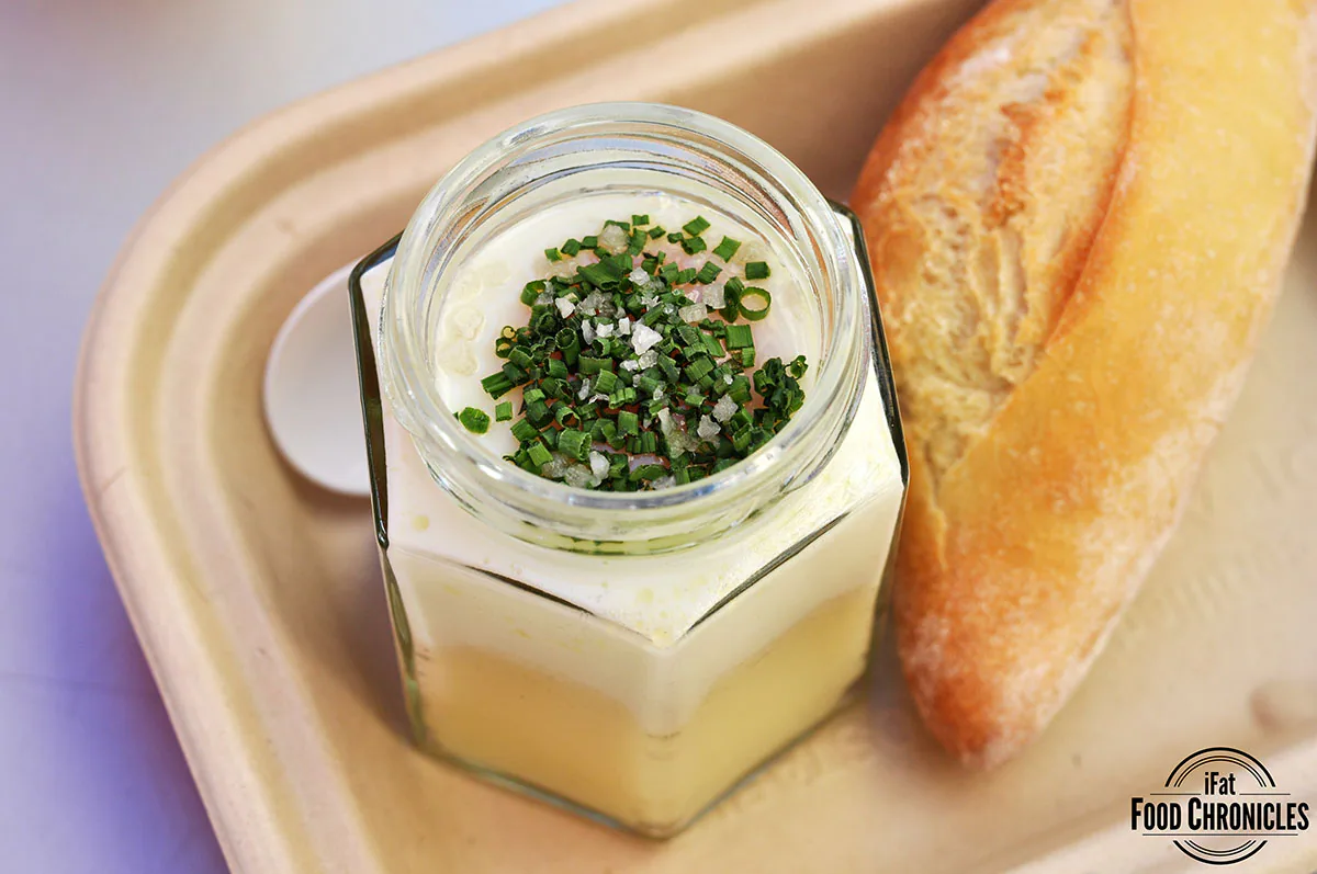 The Slut: a coddled egg on top of a smooth potato purée, poached in a glass jar and served with a demi baguette
