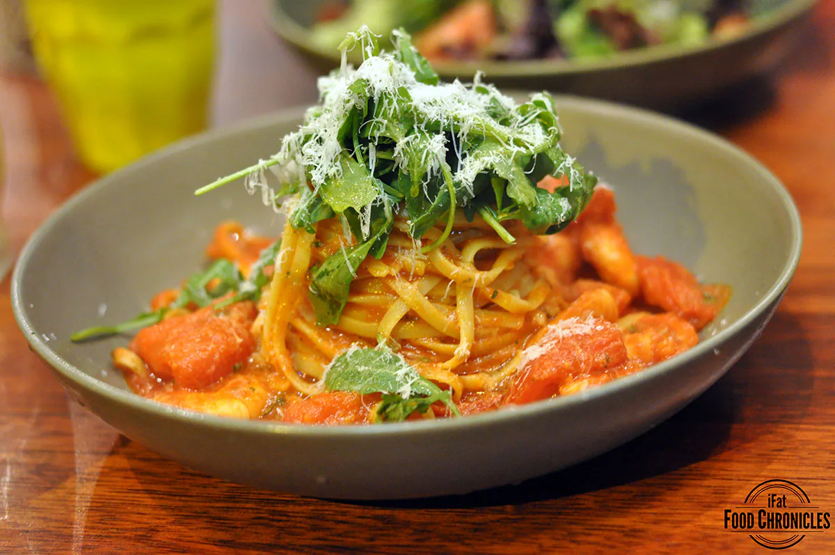 Prawn linguini with chilli tiger prawns, fresh tomato and rocket