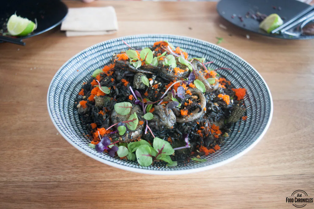 Squid Ink Fried Rice with crab, calamari, prawn, gai lan, baby corn, Chef’s squid ink sauce
