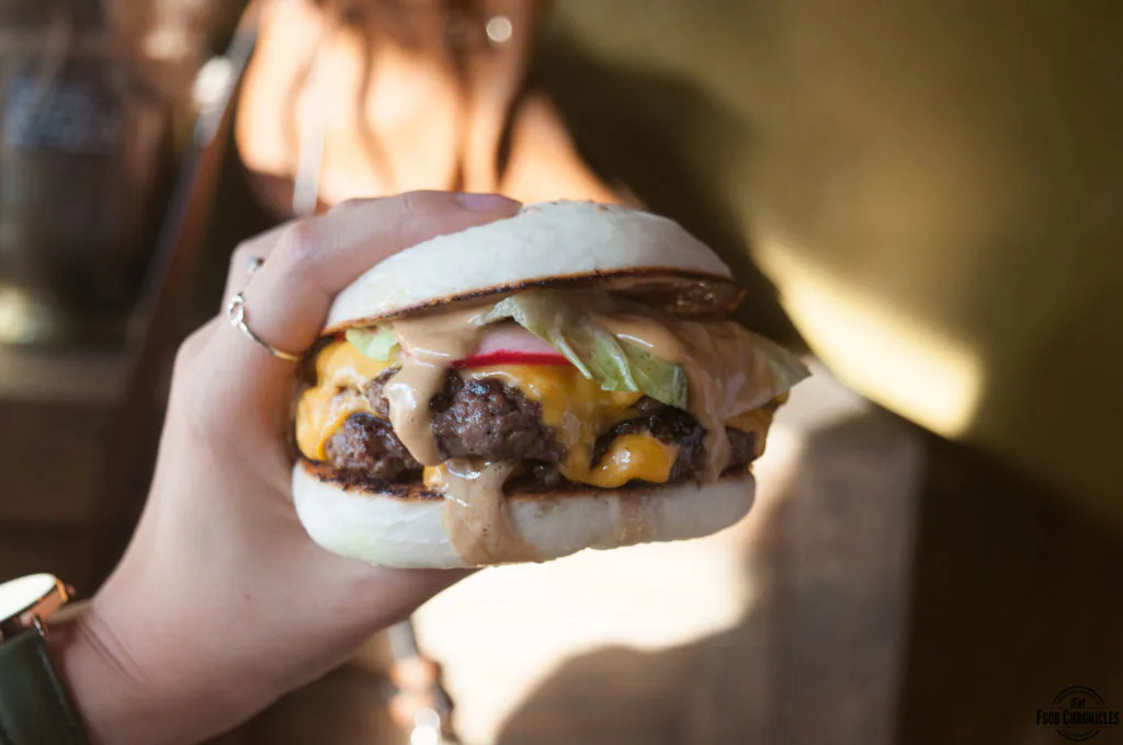 The Baoger with angus beef patty, cheese, cos lettuce, onion, pickled radish and baoger sauce