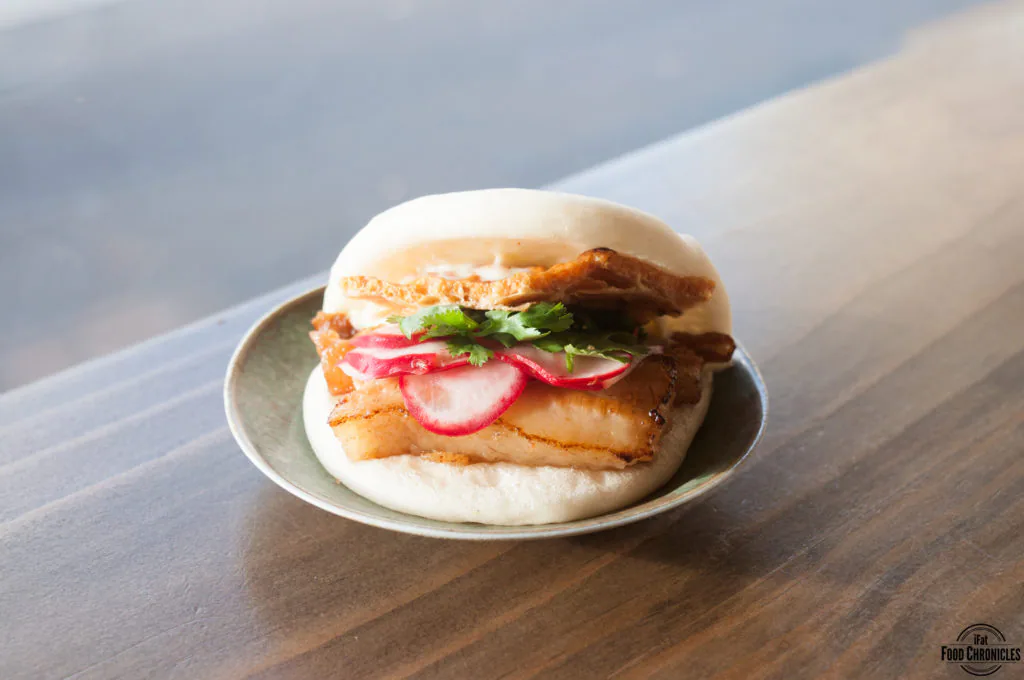 Crackling ros pork belly bao with crackling, pickled radish, corriander & kewpie mayo