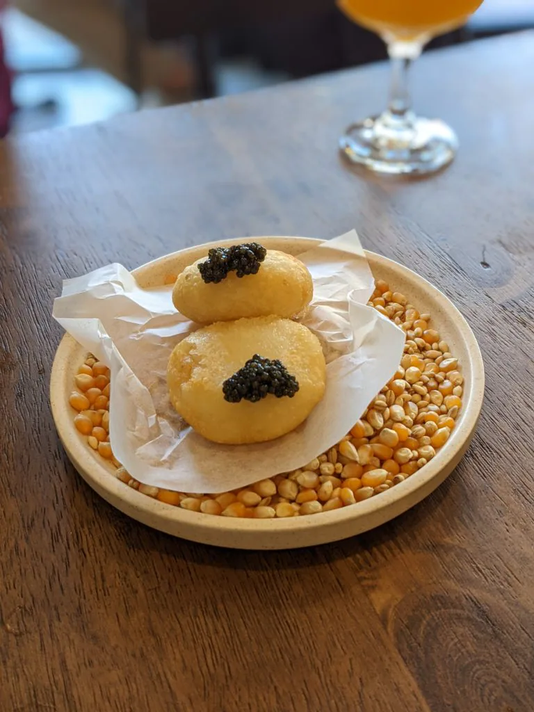 Potato cake with salted egg yolk and caviar