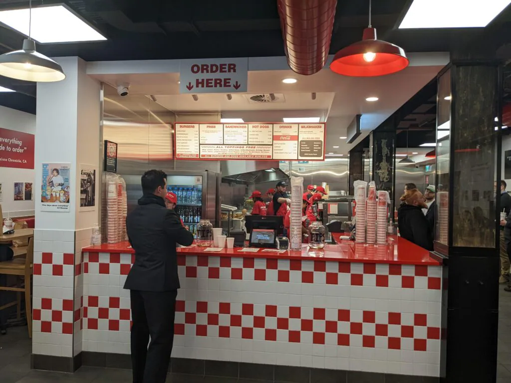 The diner setting that is a common denominator across all Five Guys restaurants