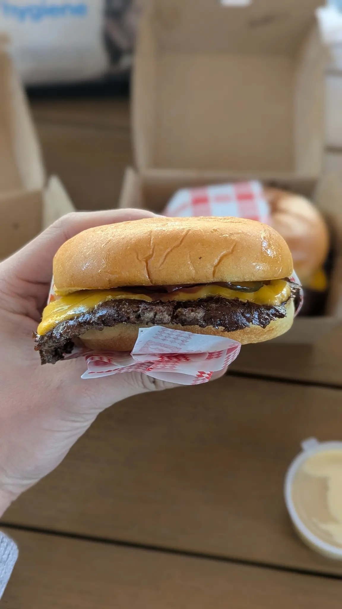 Feel Good Burgers classic cheeseburger with a smashed beef patty, cheese and pickles
