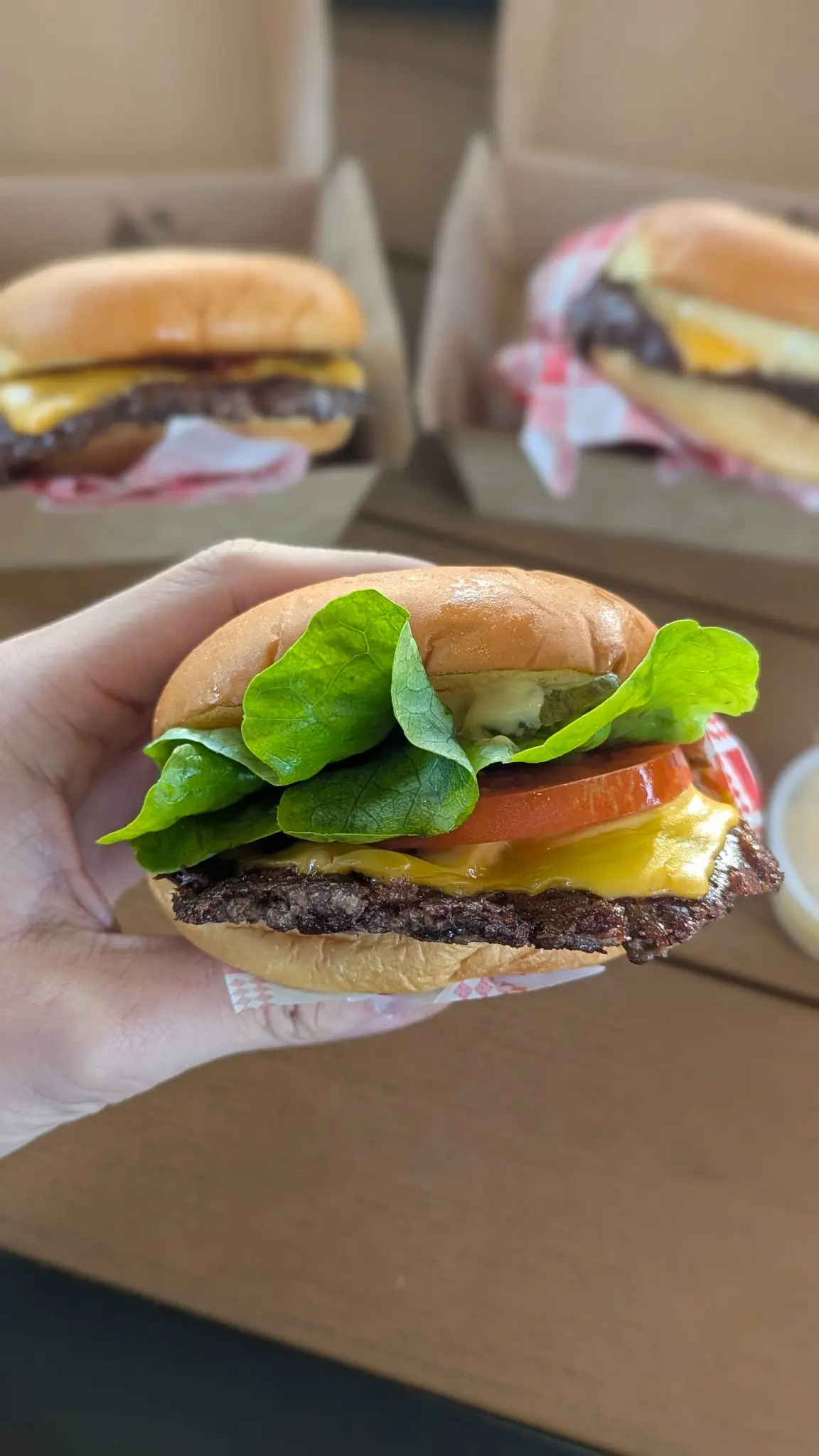 Original Feel Good Burger with a smashed beef patty, cheese, lettuce and tomato