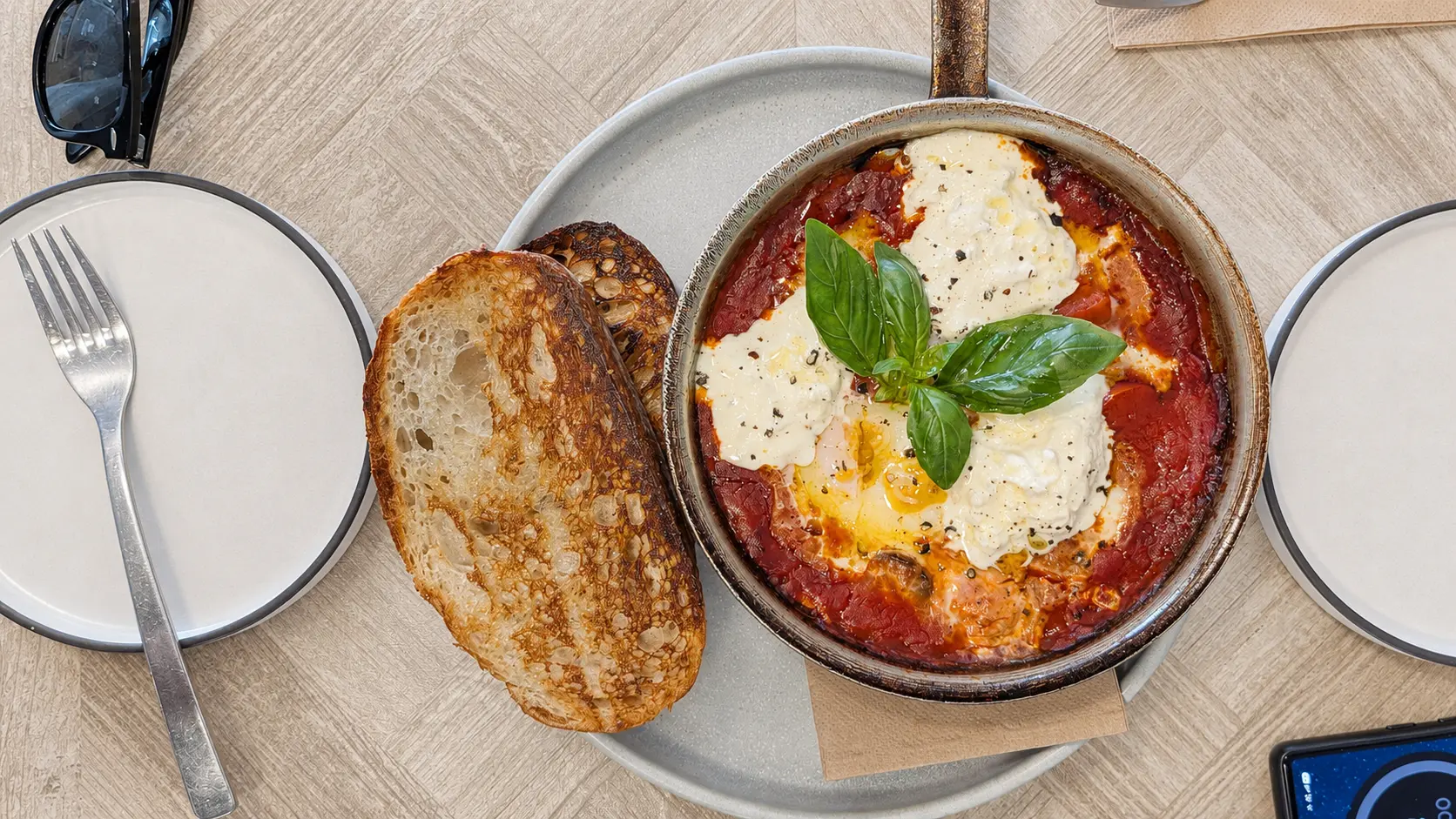 Mattina Concord West baked eggs with sujuk, stracciatella and sourdough