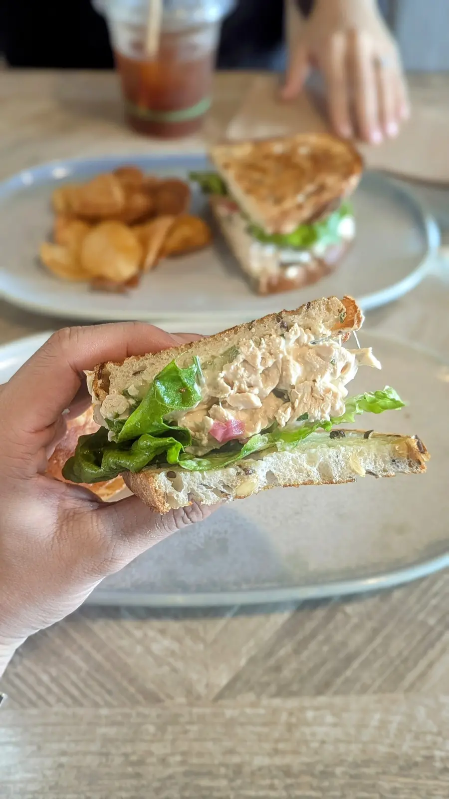 Mattina poached chicken sandwich with dill aioli and chips