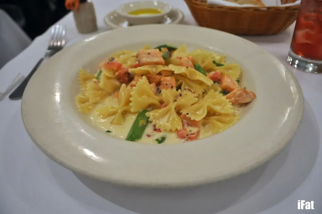 Farfelle Con Salmon e Crema aka bow tied pasta with lightly smoked salmon, tarragon grain mustard cream sauce, asparagus and fresh tomatoes.