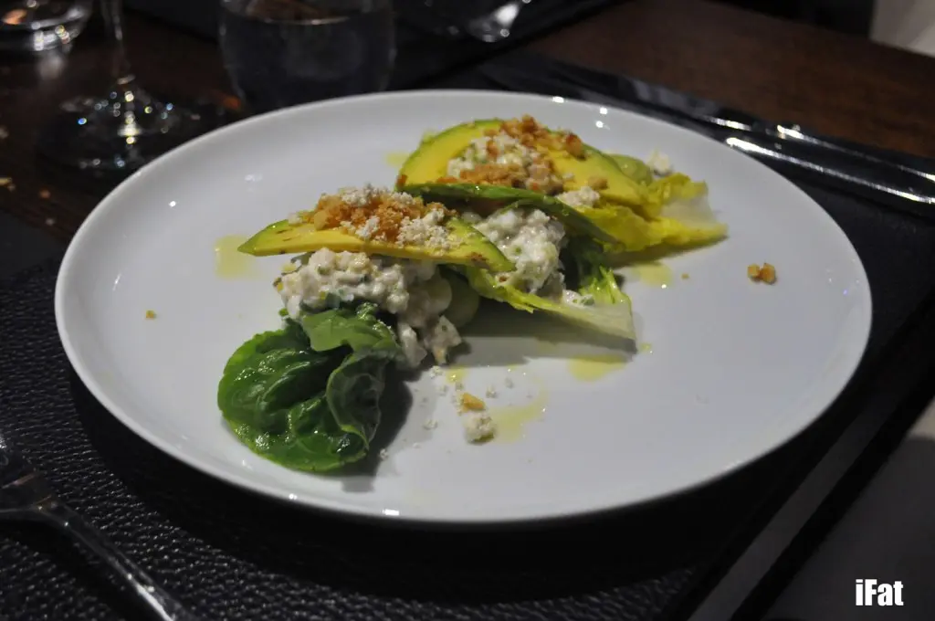 Crab salad featuring remoulade of queensland spanner crab, green apple, avocado pudding, salted peanut caramel and kaffir lime