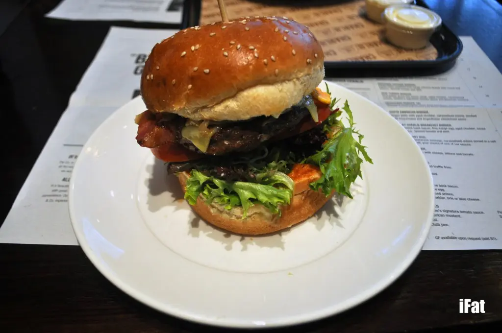 Mighty Charlie Burger featuring a wagyu patty with aged cheddar, Charlie & Co