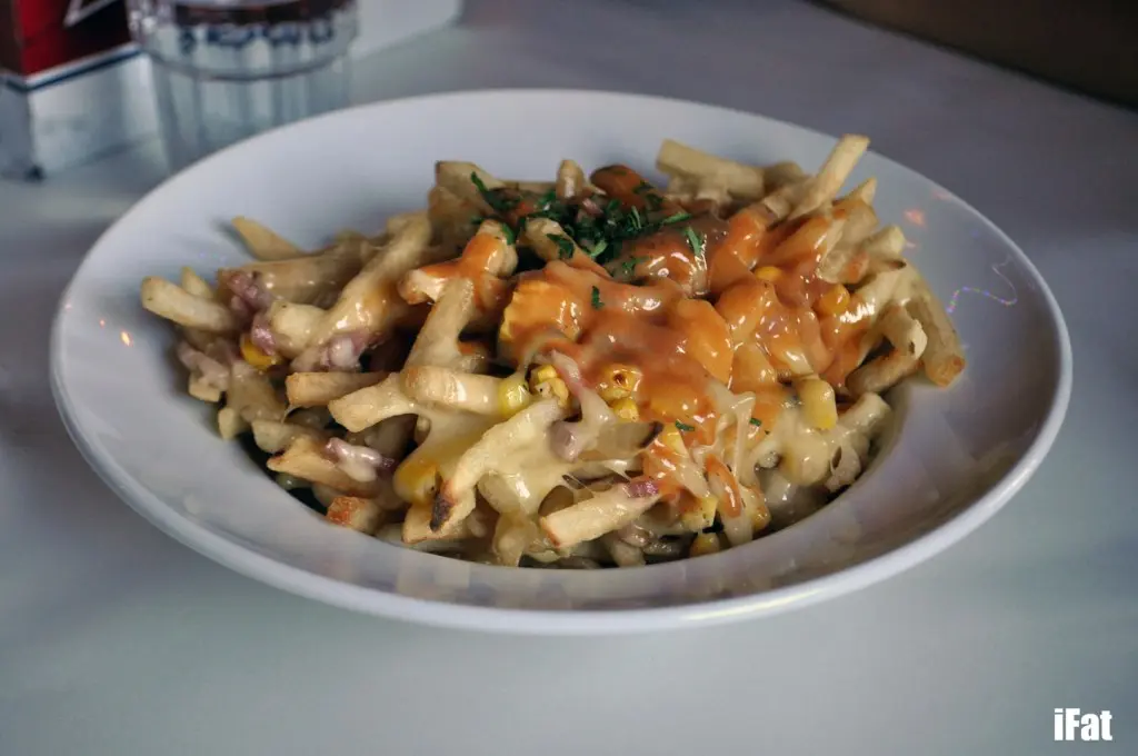 Lobster fries with lobster gravy, bacon and corn.
