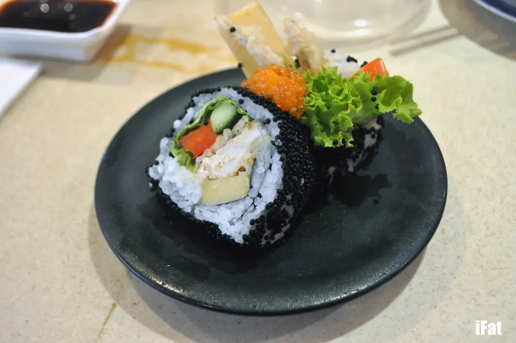 Soft shell crab roll with black sesame, tamago, cucumber and capsicum