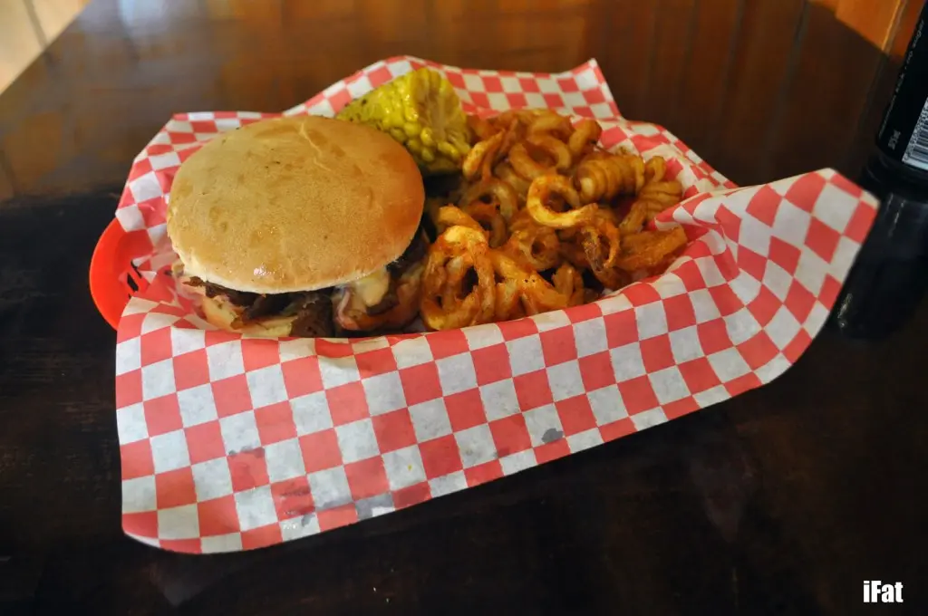 Beef brisket burger served with coleslaw, cheese and ranch sauce