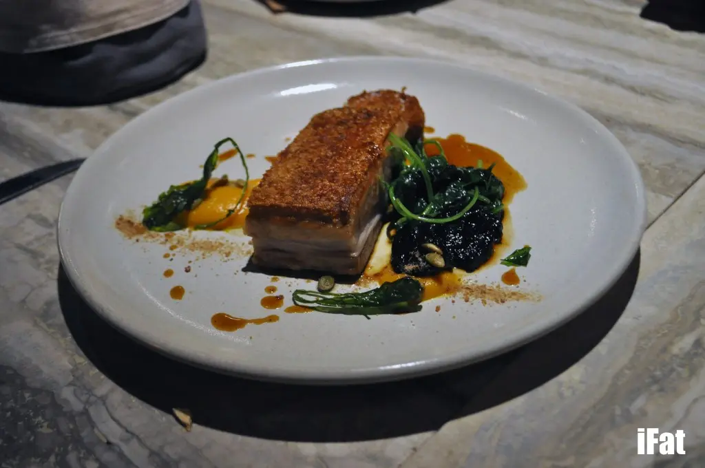 Pork Belly with crackling, pumpkin, tuscan cabbage and pepper jus