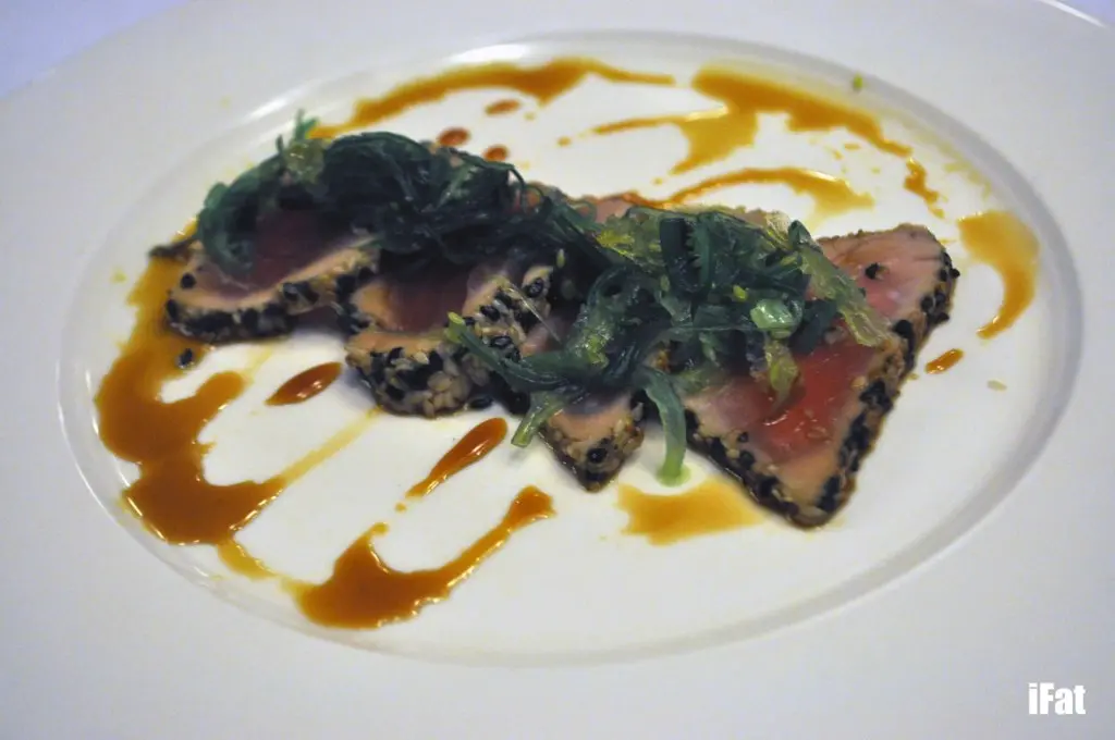 Sesame crusted yellow fin tuna with wakame seaweed, pickled ginger, and a soy ginger glaze