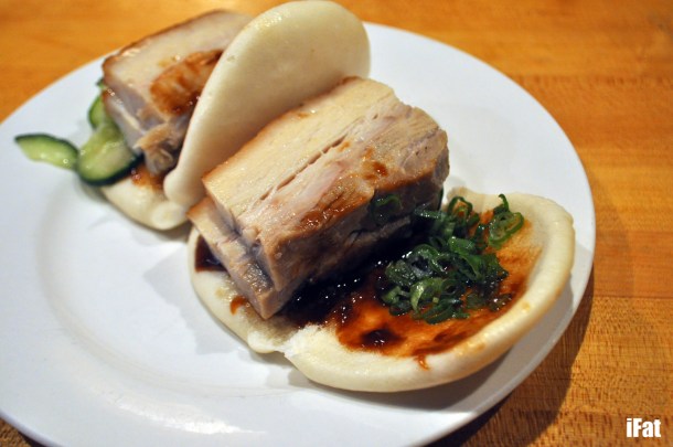 Momofuku pork buns with hoisin sauce, scallion and cucumber.