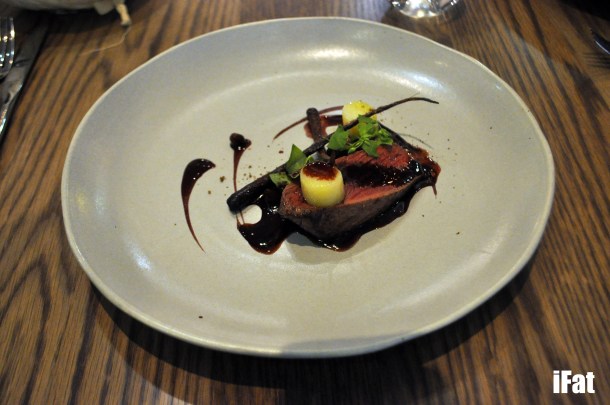 Kangaroo with purple carrots, riberry sauce and native pepper.
