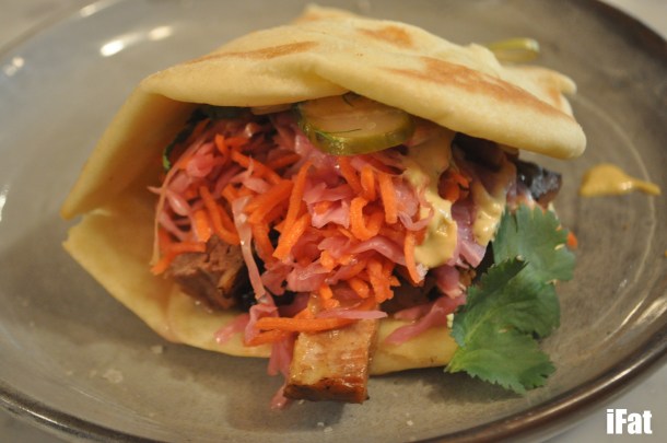 Glazed beef brisket narnie with slaw, pickles and chipotle mayo.